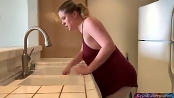 Mature And Teen Couple In Kitchen
